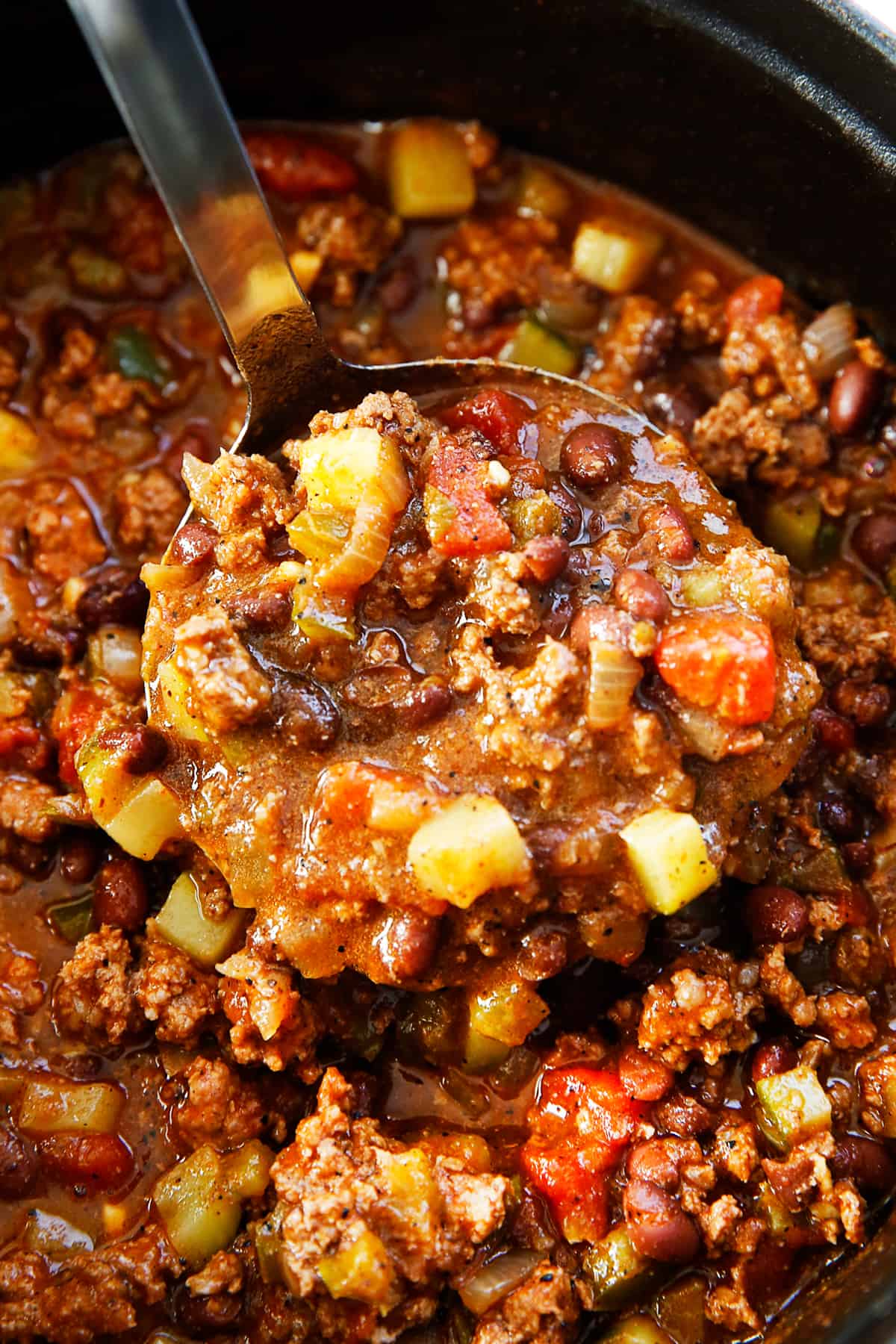 Taco soup in a ladle.