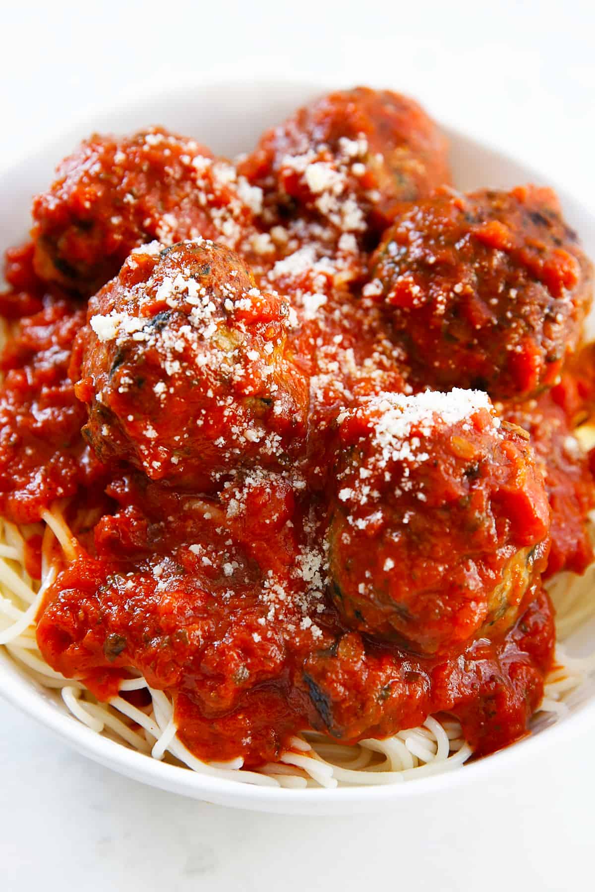 Paleo turkey meatballs in a bowl with marinara sauce.