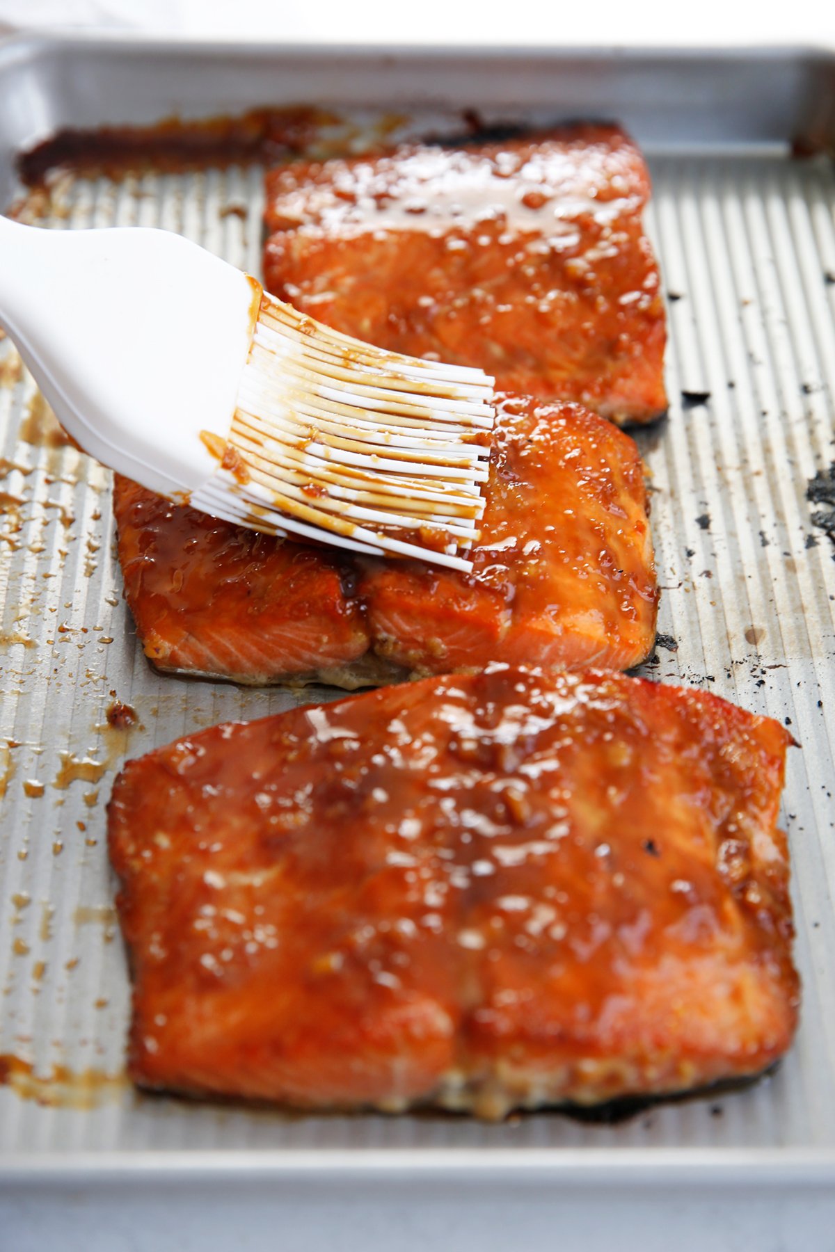 Brush on asian salmon marinade on to the salmon filets.