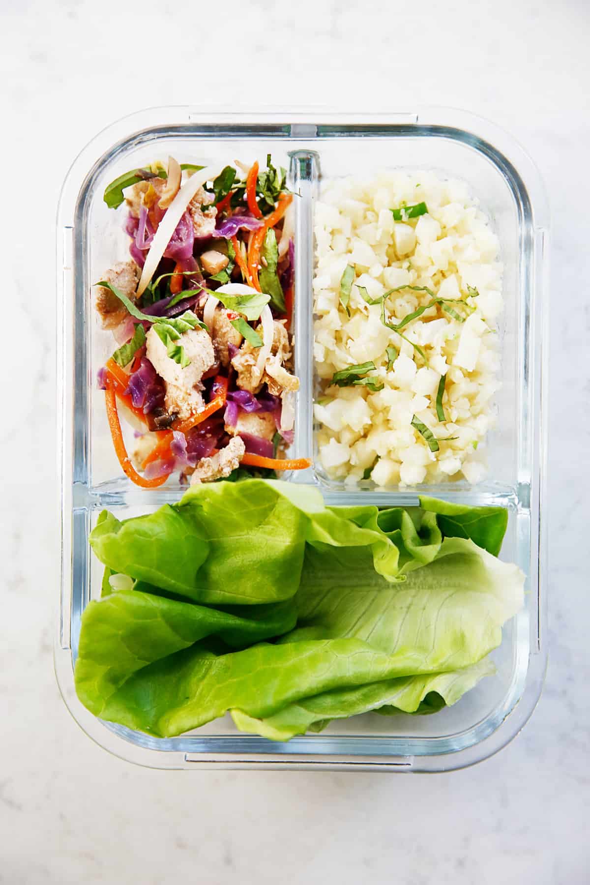 Thai Chicken Lettuce Wraps deconstructed in a meal prep container.