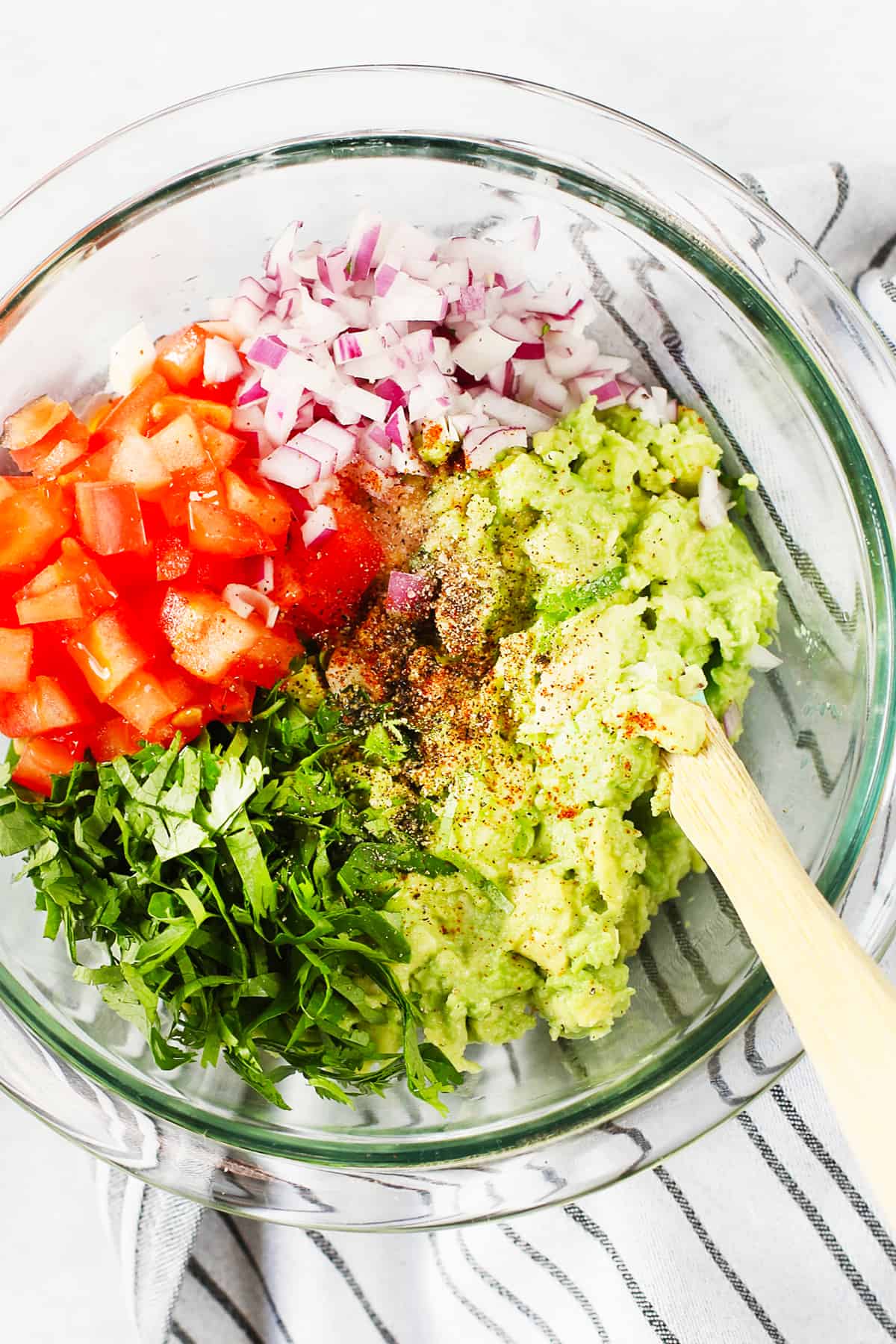 Ingredients in a bowl for homemade guacamole.