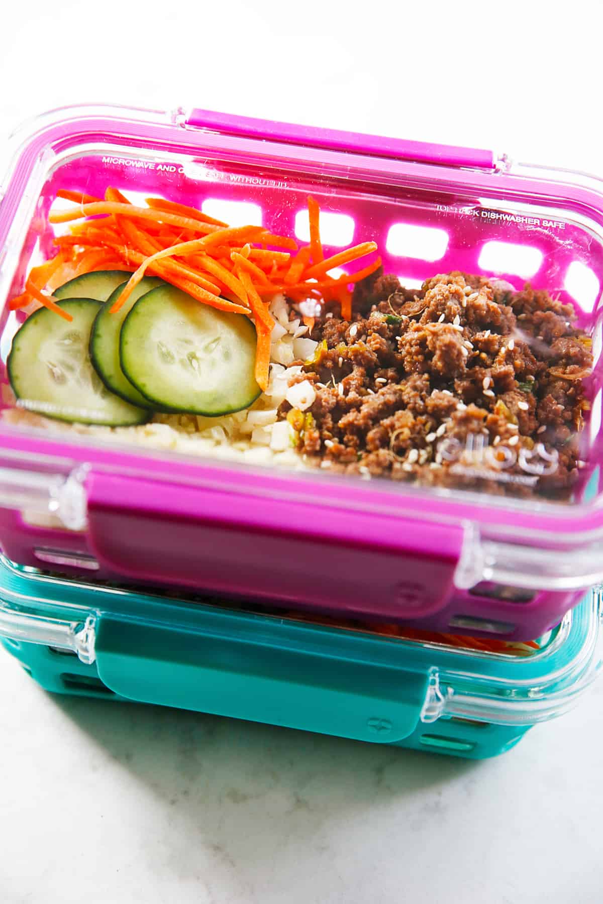 Korean ground beef bowls in meal prep containers.