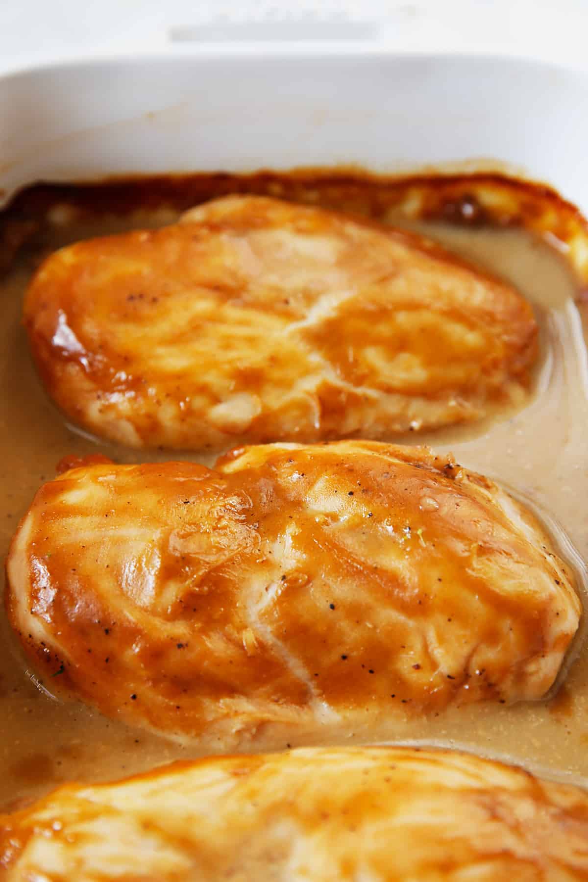 Maple mustard chicken in oven dish.