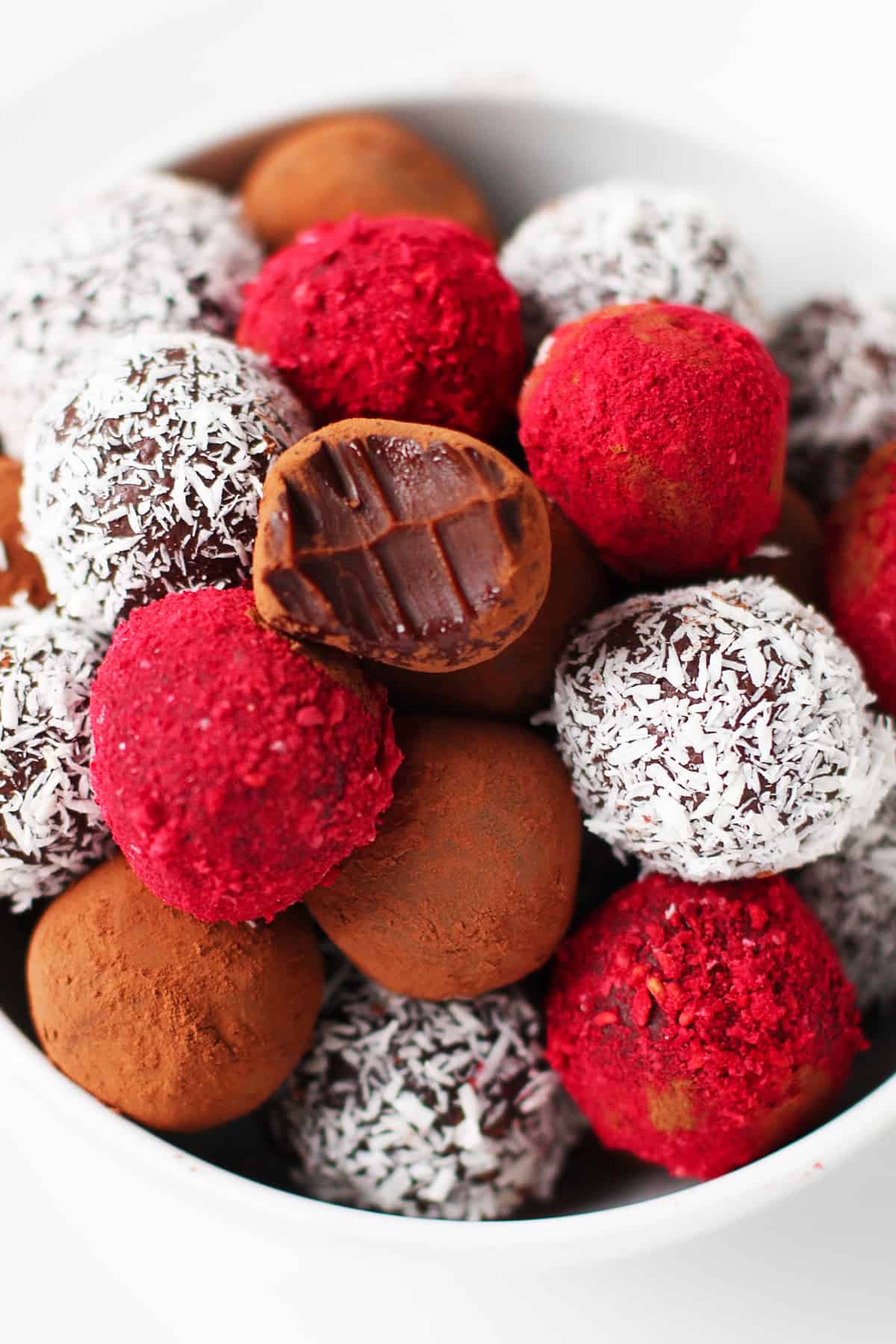 Bowl of different flavors of chocolate truffles.