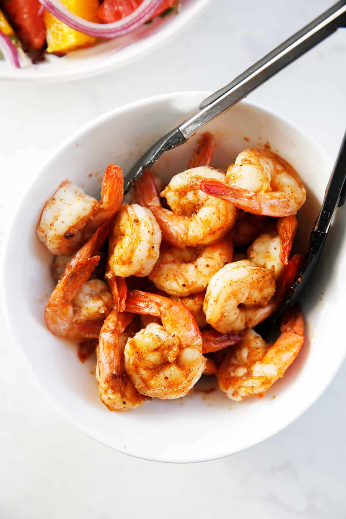 Cooked spicy shrimp for the salad in a bowl.