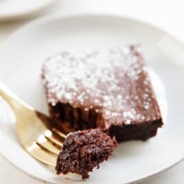 a bite of a healthy brownie on a fork with the brownie.