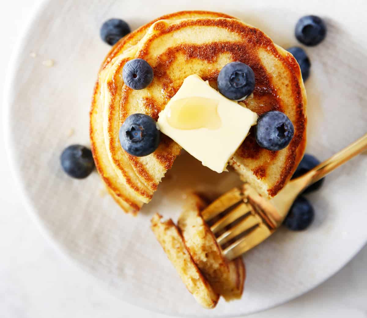 Paleo Pancakes with blueberries and butter.