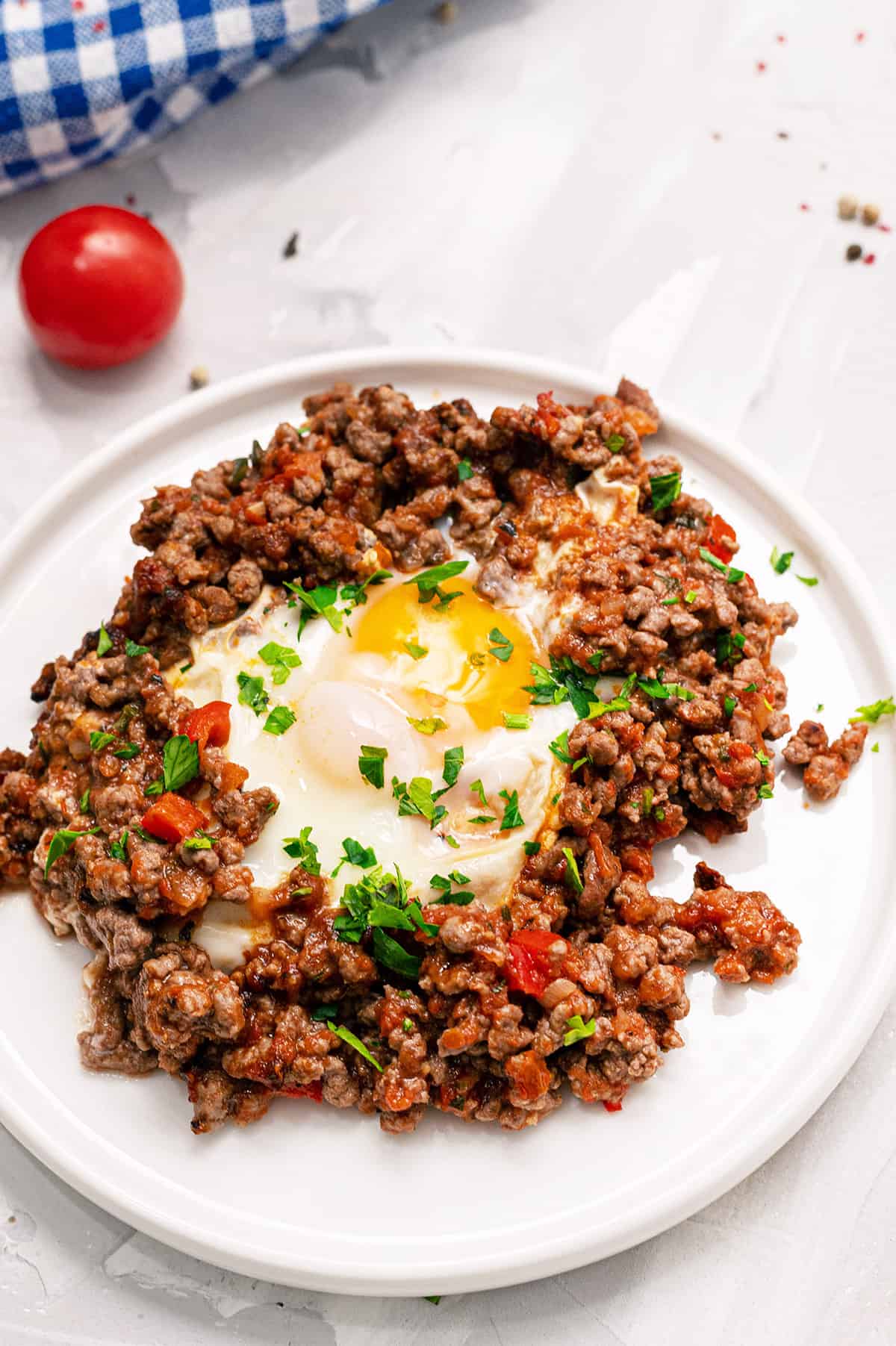 Breakfast skillet with eggs on a plate.