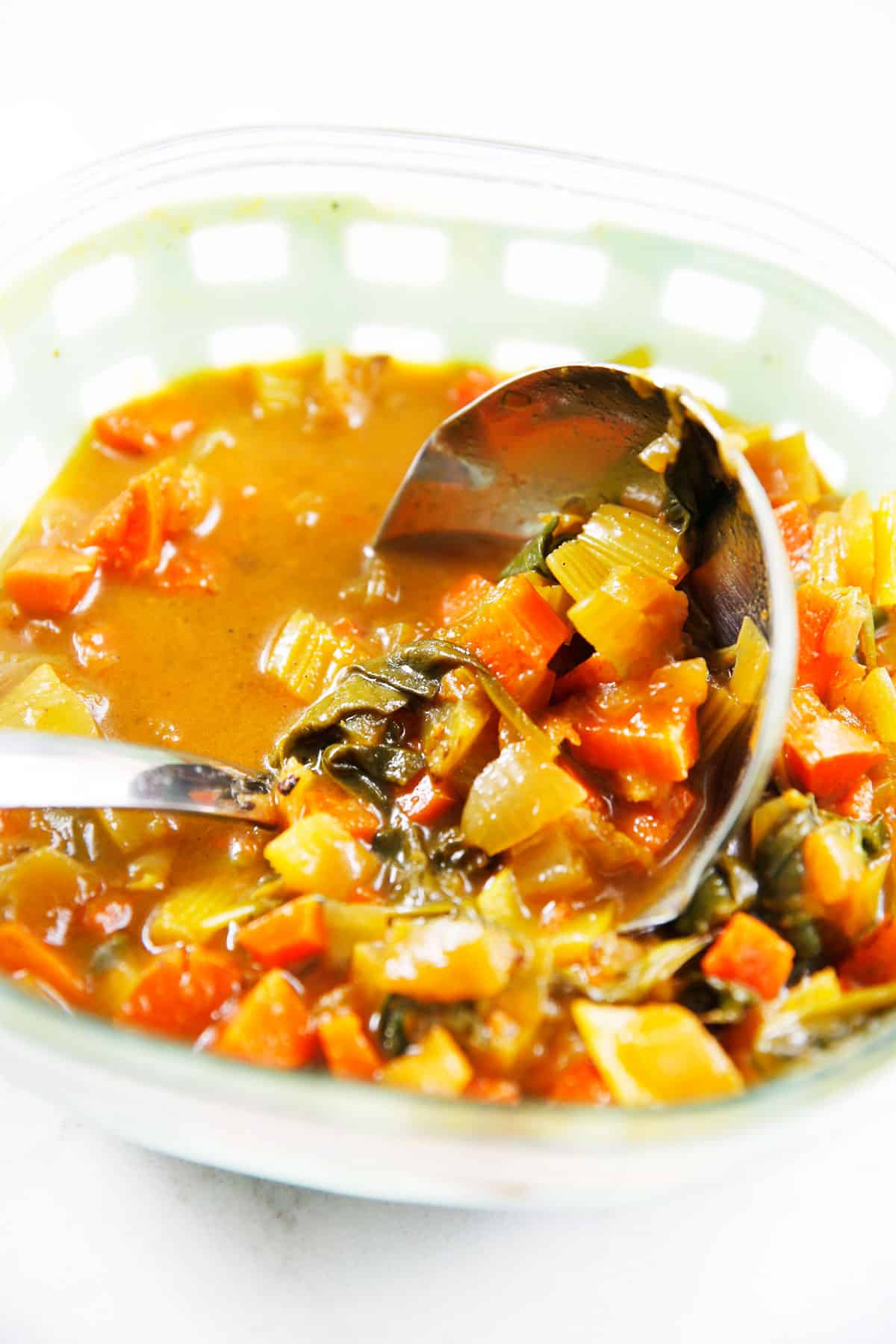 Feel Good Detox Soup with a ladle in it.