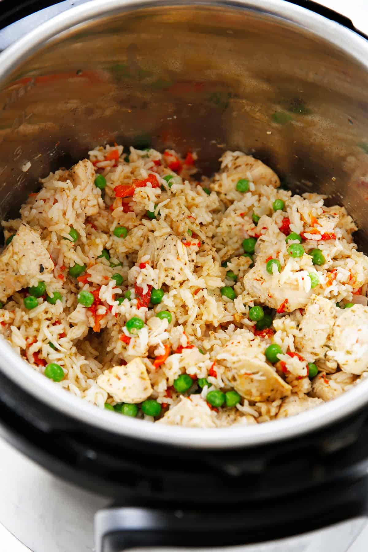 Cooked instant pot chicken and rice with peas.