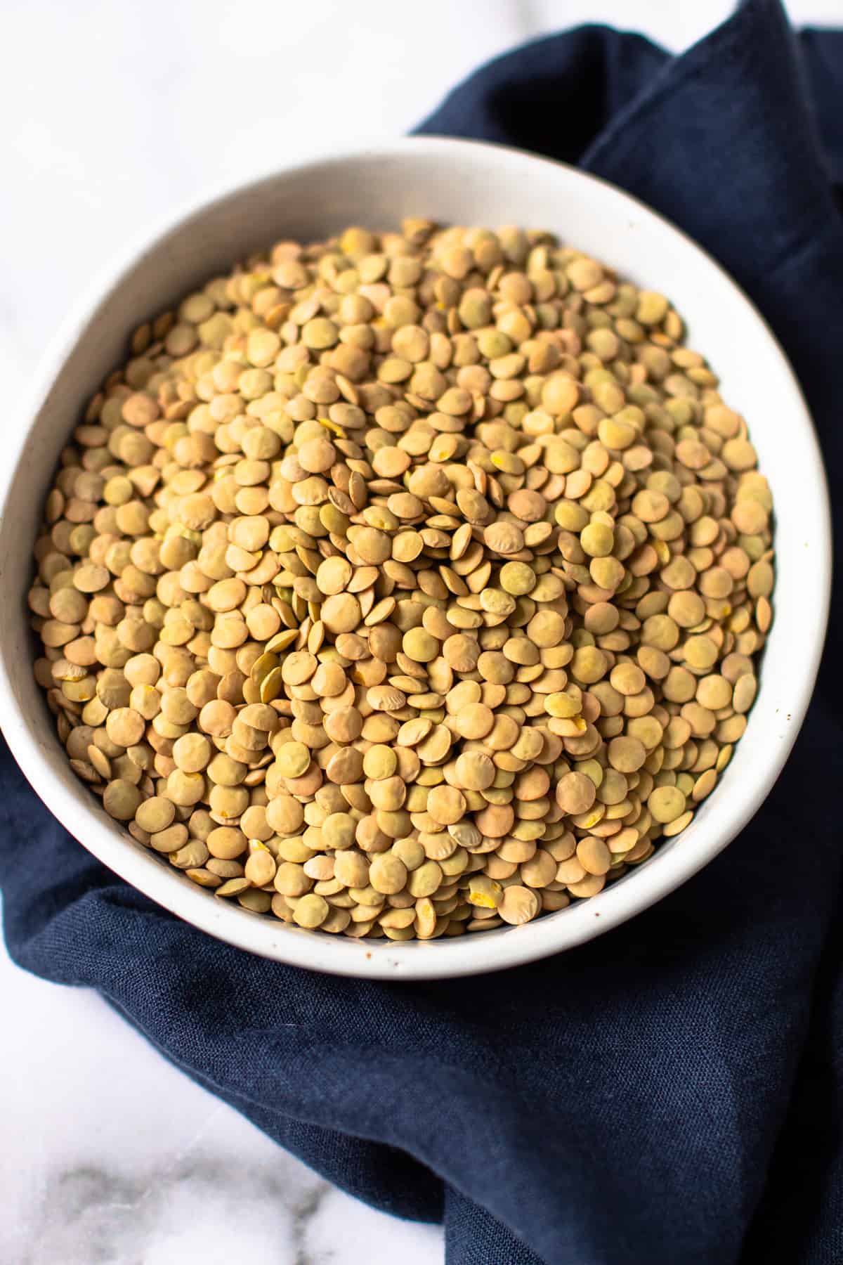 Uncooked lentils in a bowl.