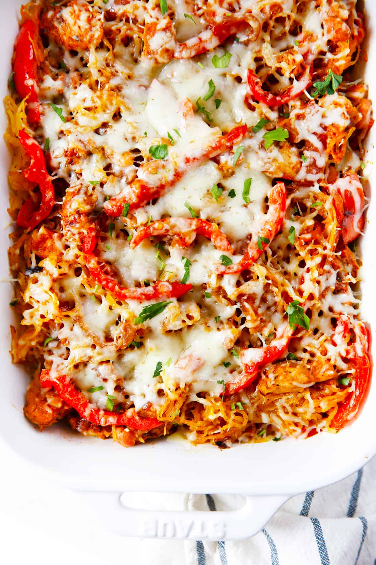 A baked fajita squash casserole with melty cheese on top.