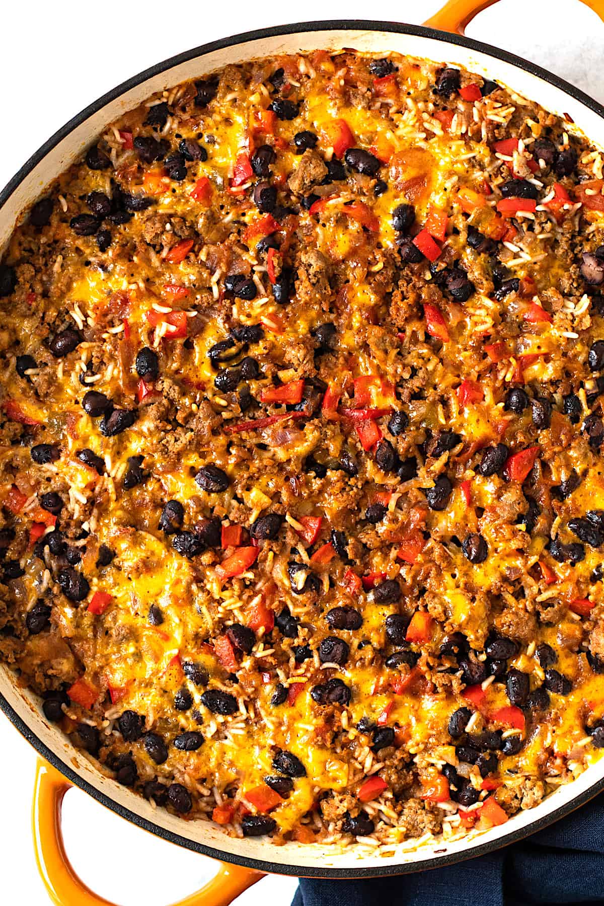Baked taco casserole in a skillet.