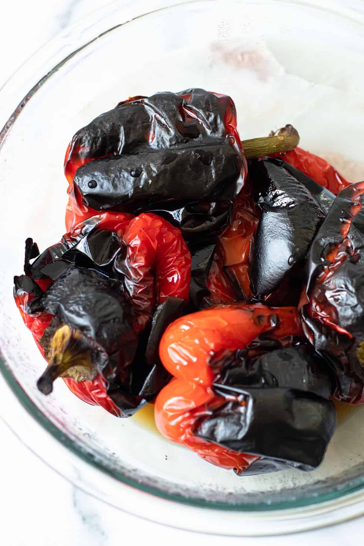 charred bell peppers in a bowl overhead.