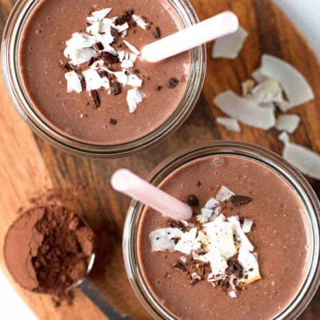 Chocolate Coconut Smoothie in a glass with straws.