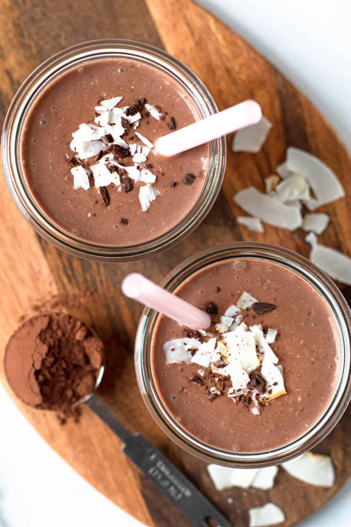 Chocolate Coconut Smoothie in a glass with straws.