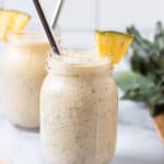 Pina Colada Smoothie with a pineapple garnish.