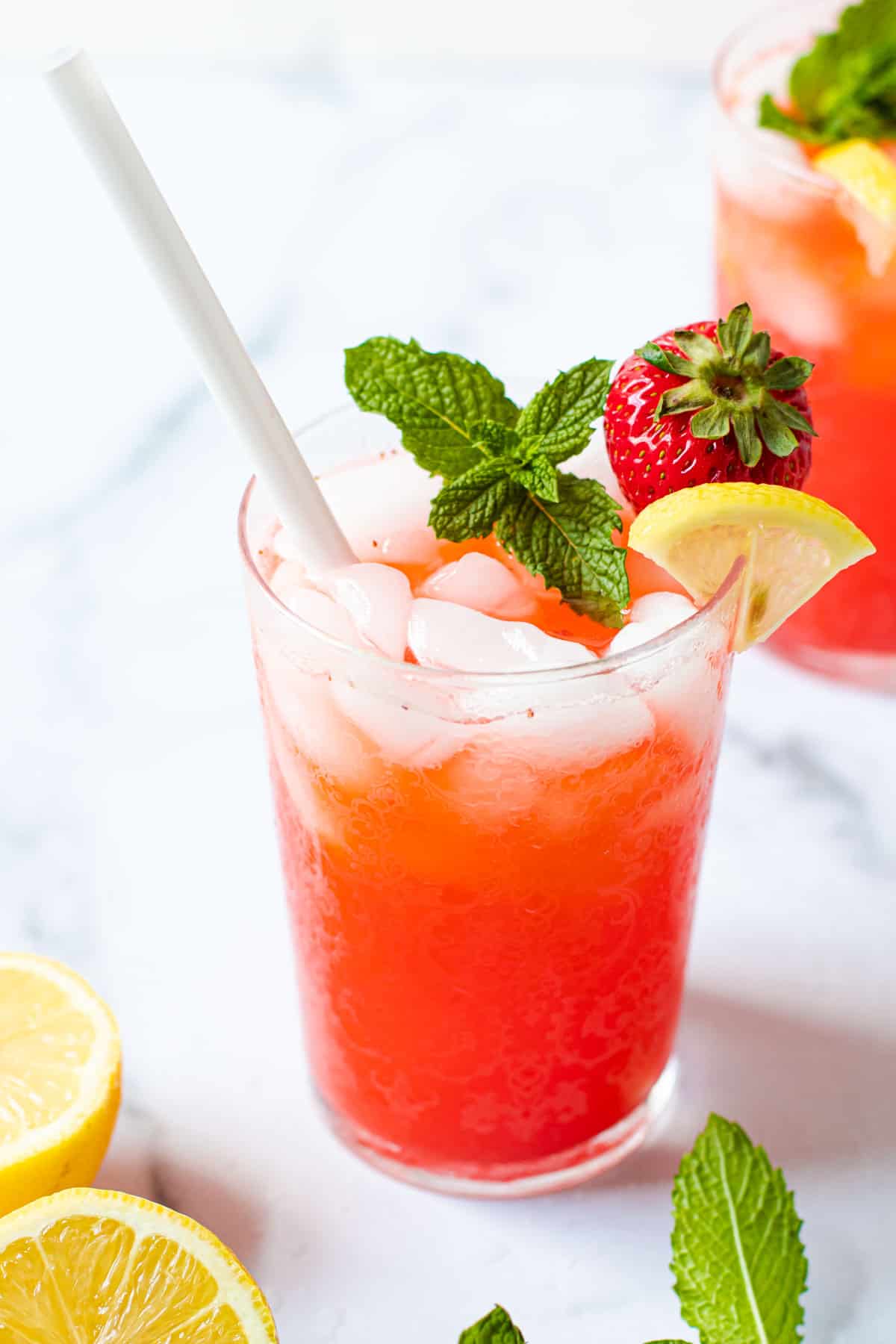 A frosty glass of strawberry lemonade.