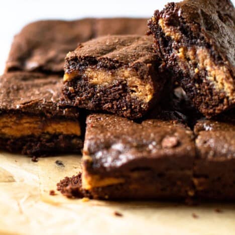 A stack of gluten-free peanut butter brownies.