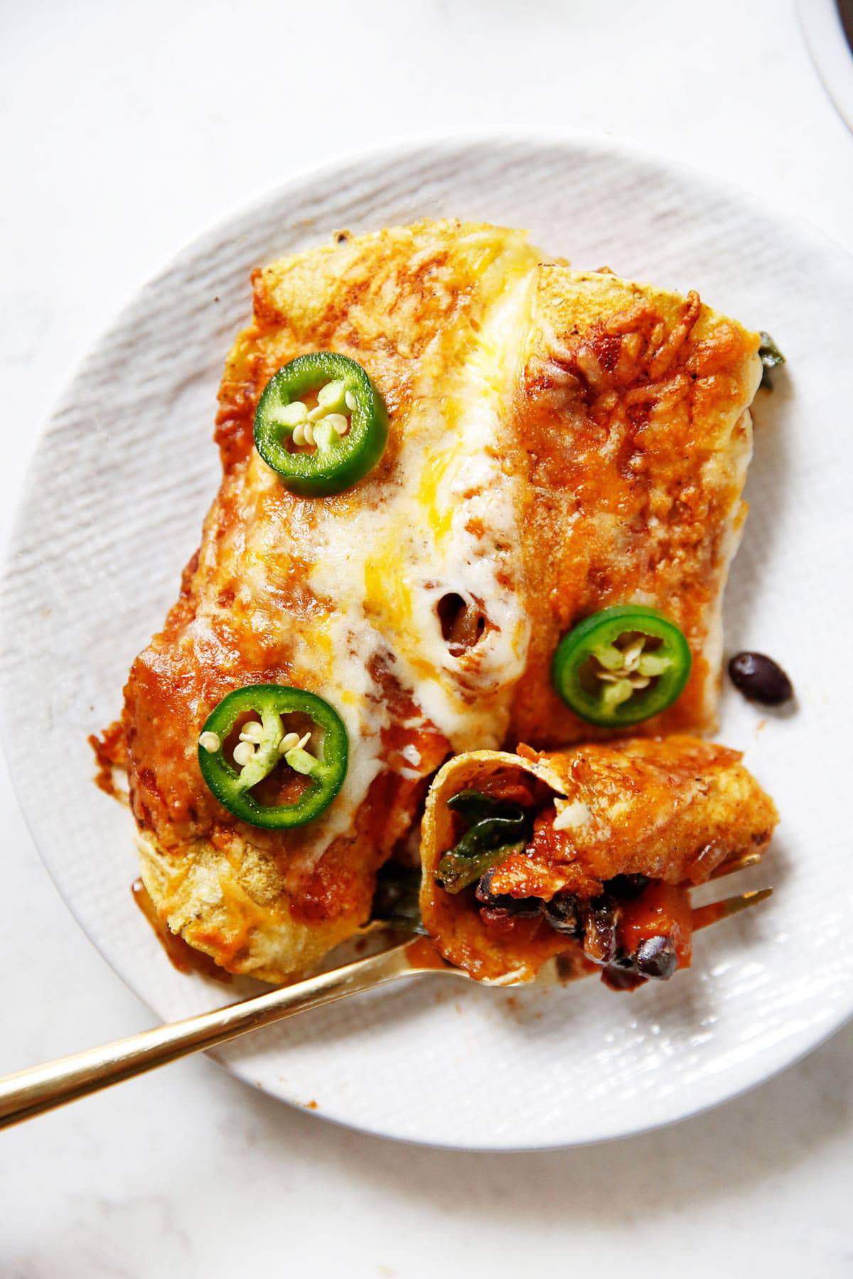 A plate of sweet potato and black bean enchiladas.