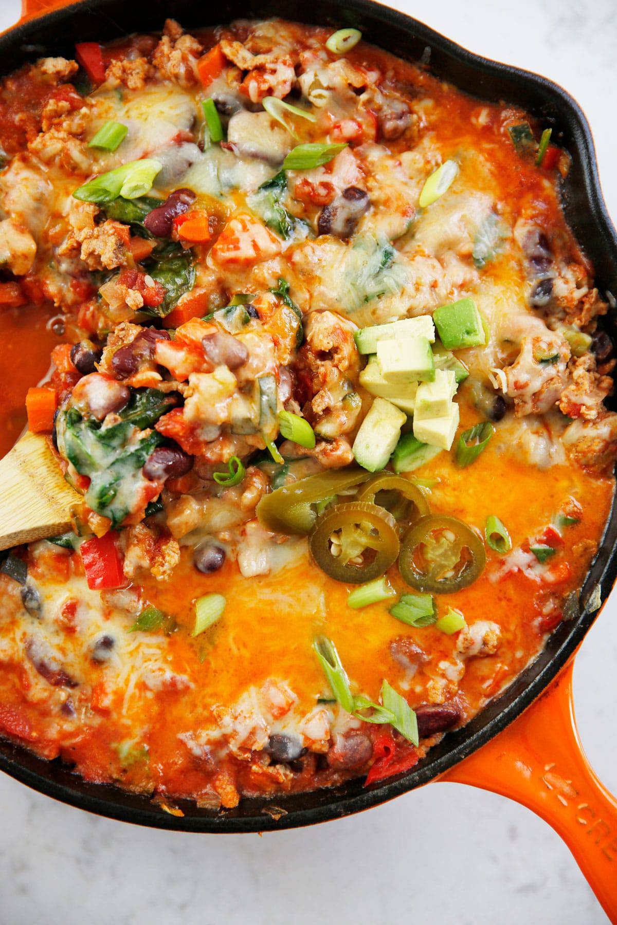 An orange skillet with an easy one pan taco filling.