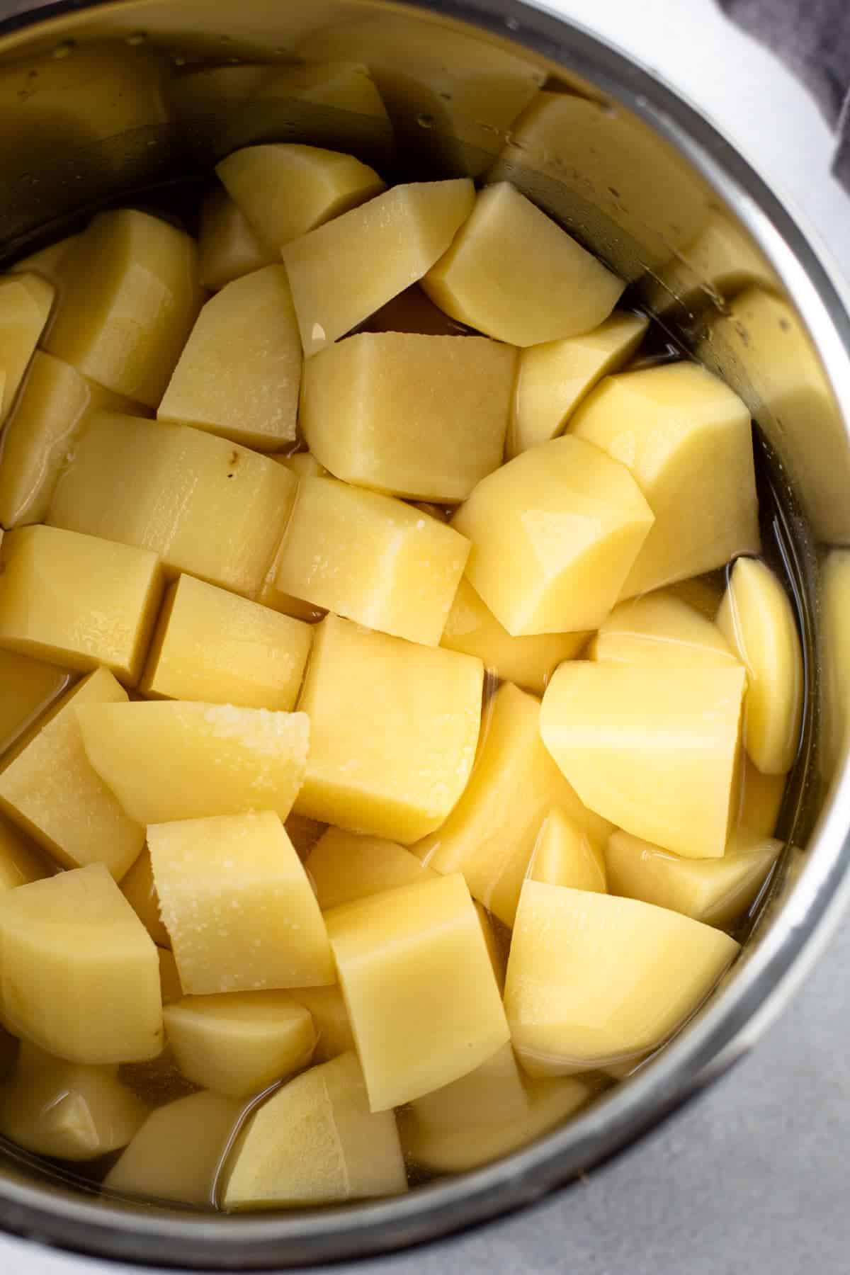 Cubed and raw potatoes in an instant pot.