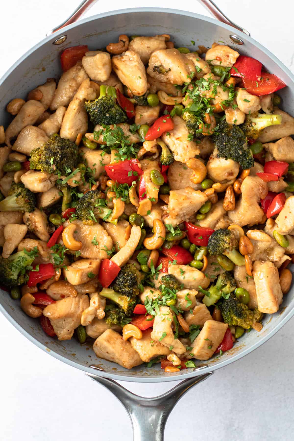 A skillet of cashew chicken.