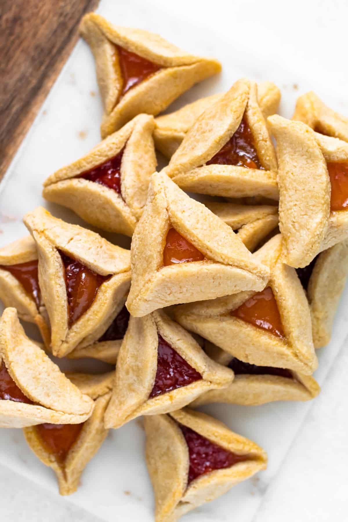Paleo hamantaschen with apricot and raspberry jam.