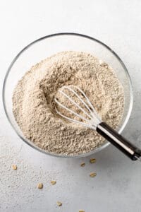 Homemade oat flour in a bowl.