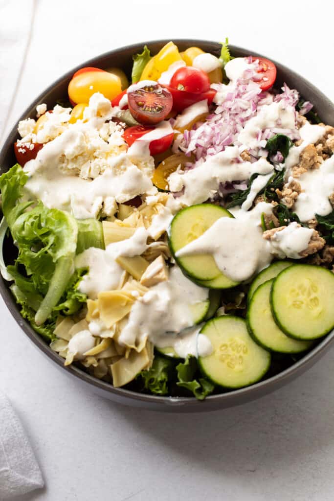 A mediterranean chopped turkey salad with creamy dressing.