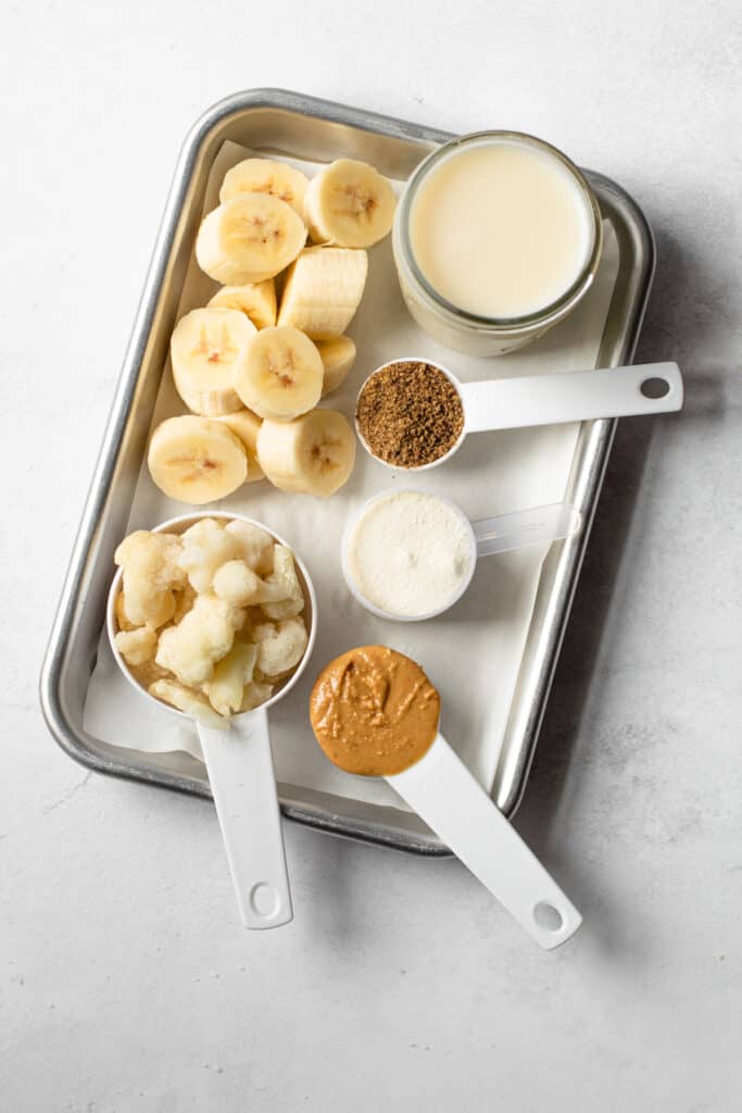 Ingredients for peanut butter banana smoothie.