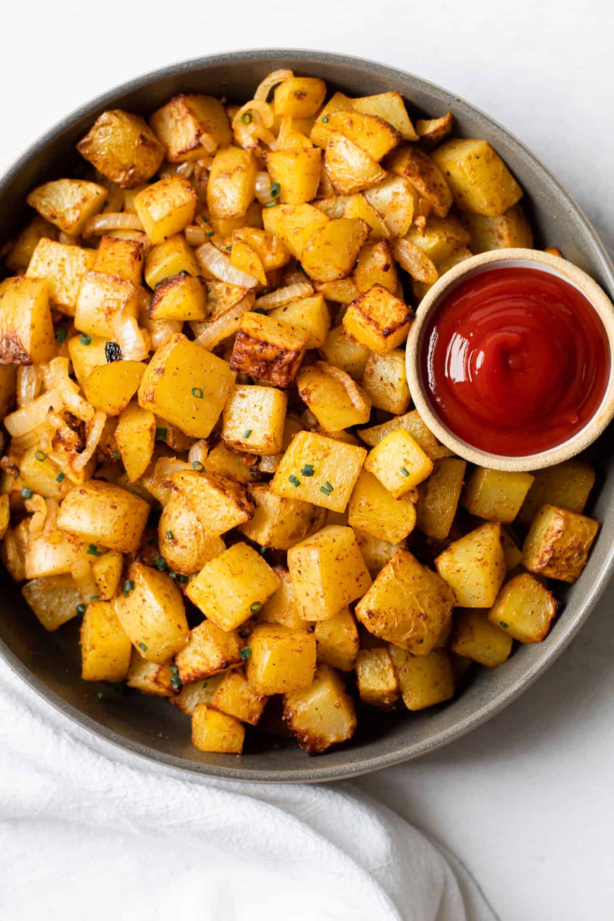 A bowl of air fryer home fries.