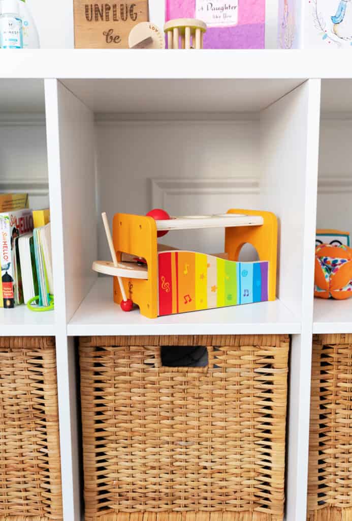 A shelf with non toxic baby toys.