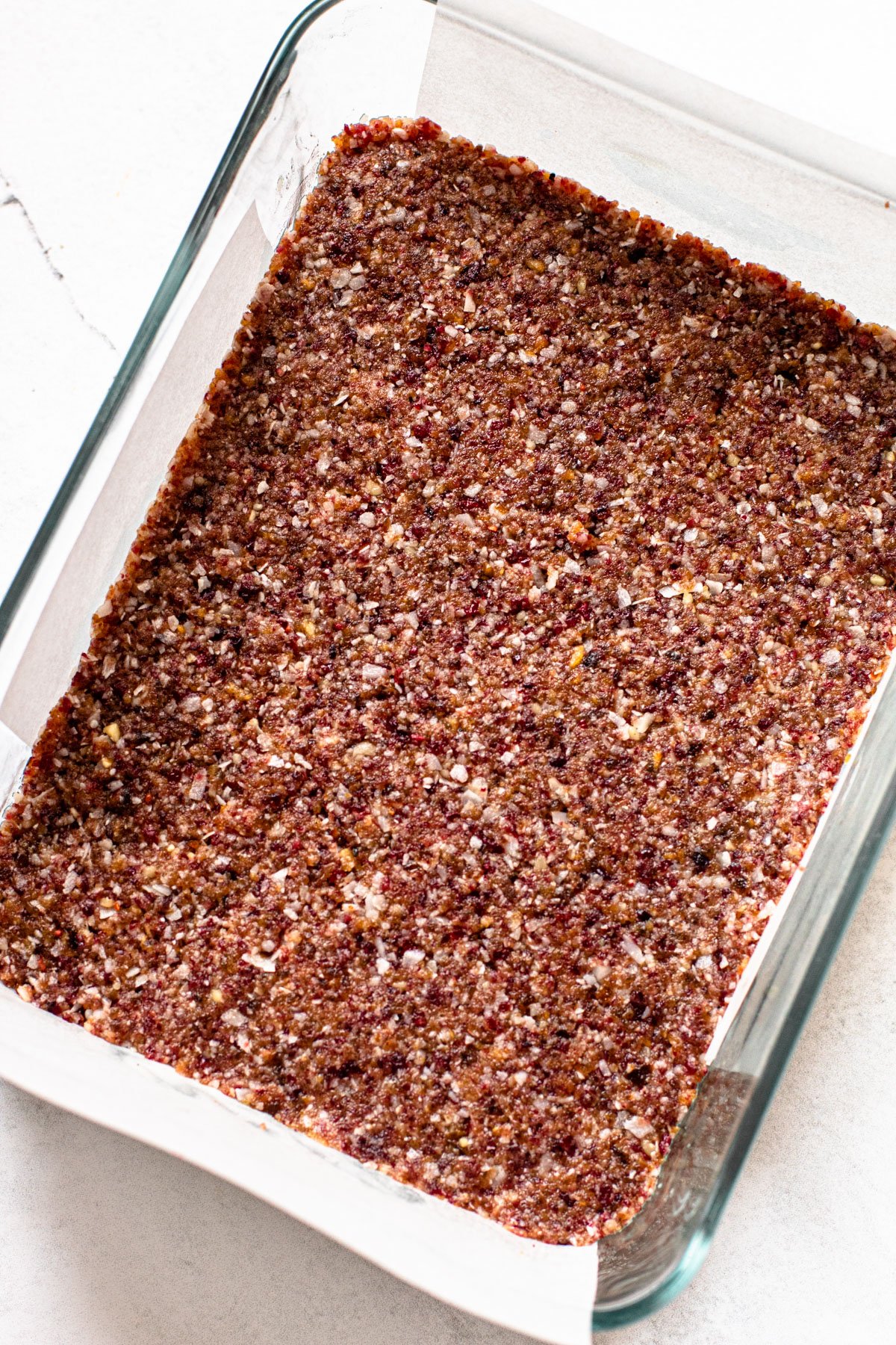 Cranberry coconut bars in a container.