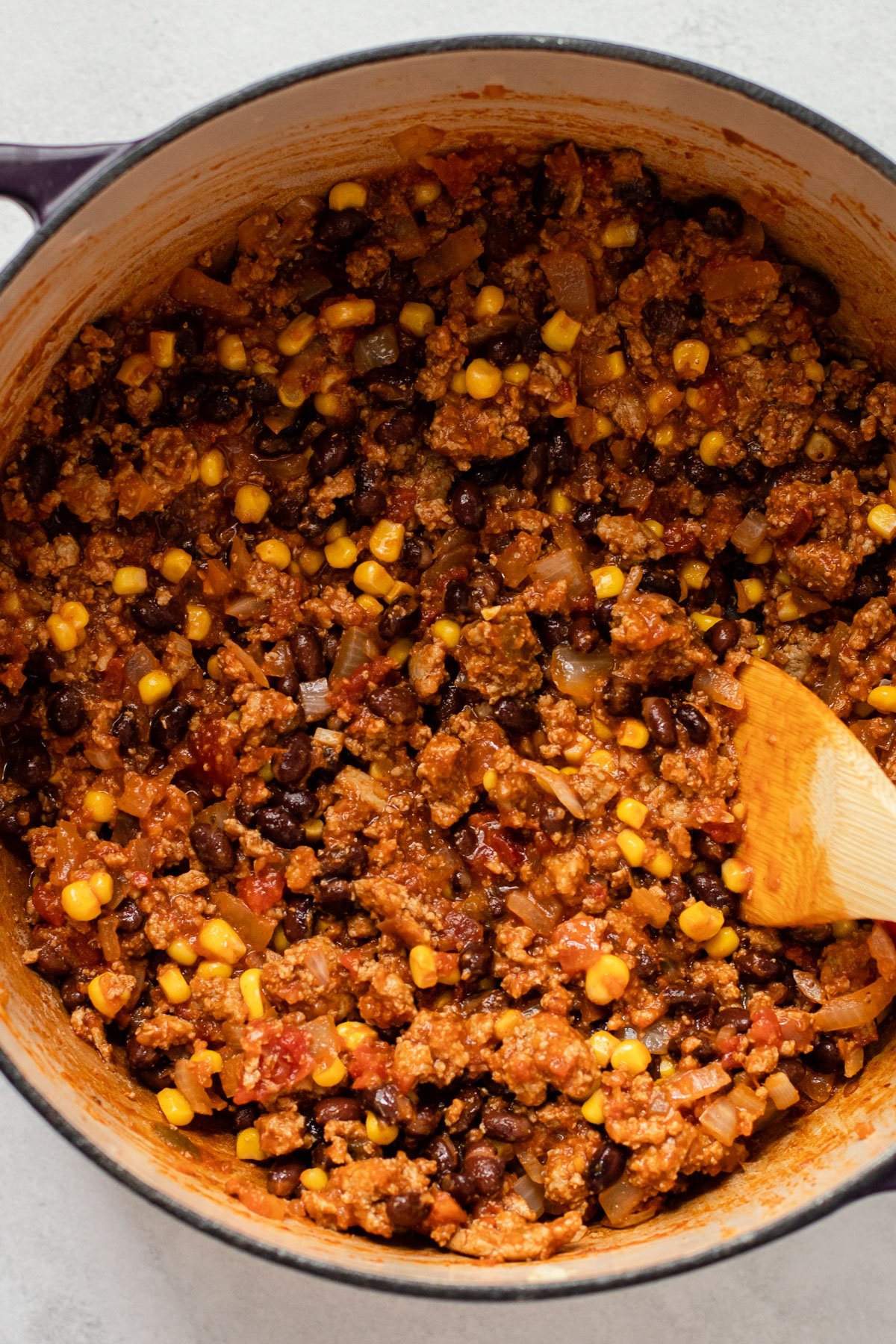 Ground meat with beans and corn for taco pasta.