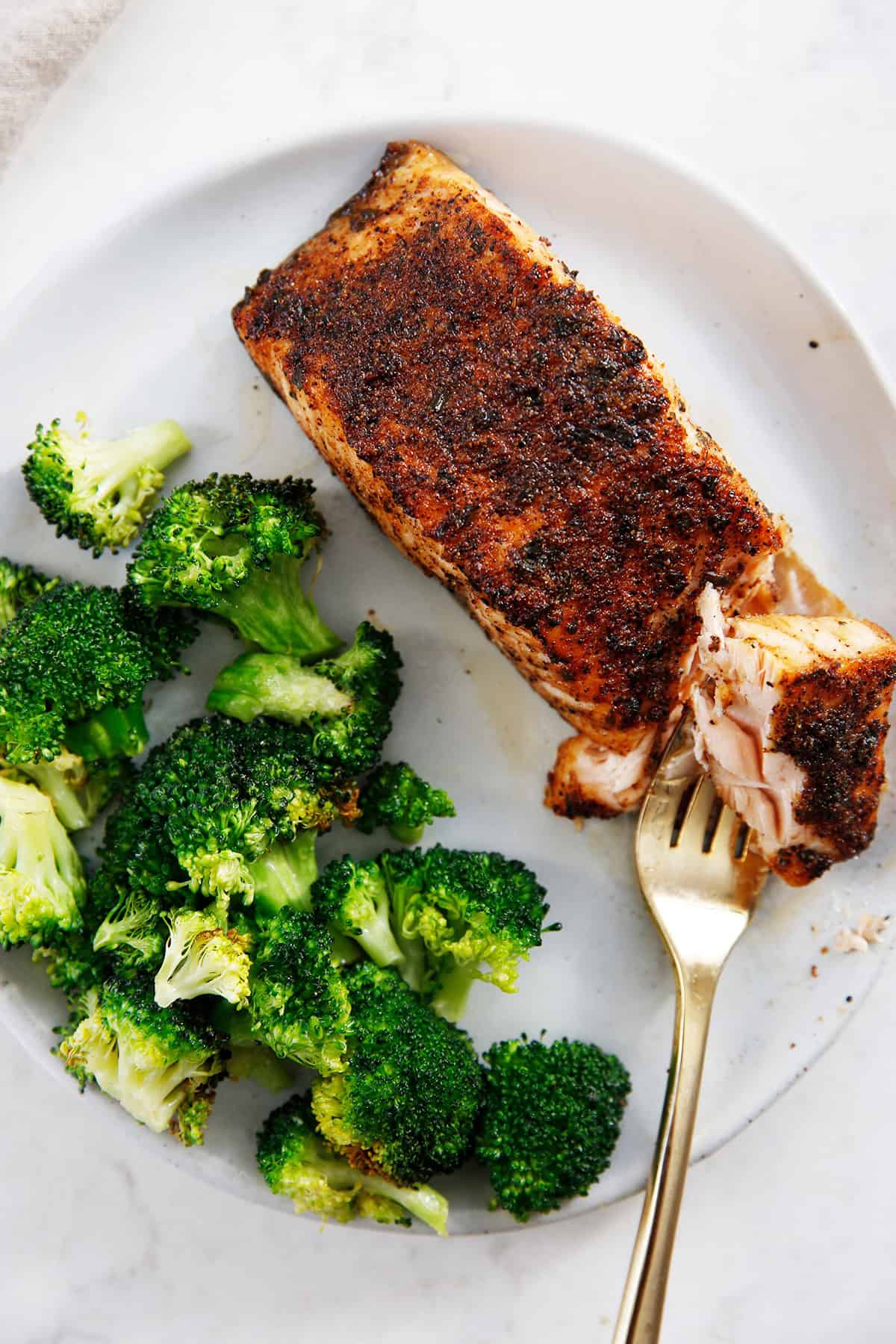  air fryer broccoli recipe on a plate with salmon