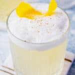 Gin Fizz Cocktail with a lemon twist and nutmeg garnish