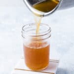 Pouring simple syrup into jar