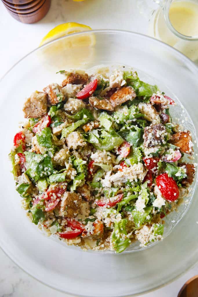 A bowl of mixed Chicken Caesar Quinoa Salad