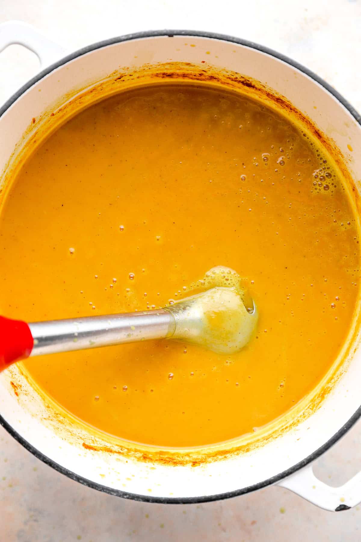 Immersion blender into the tender soup.