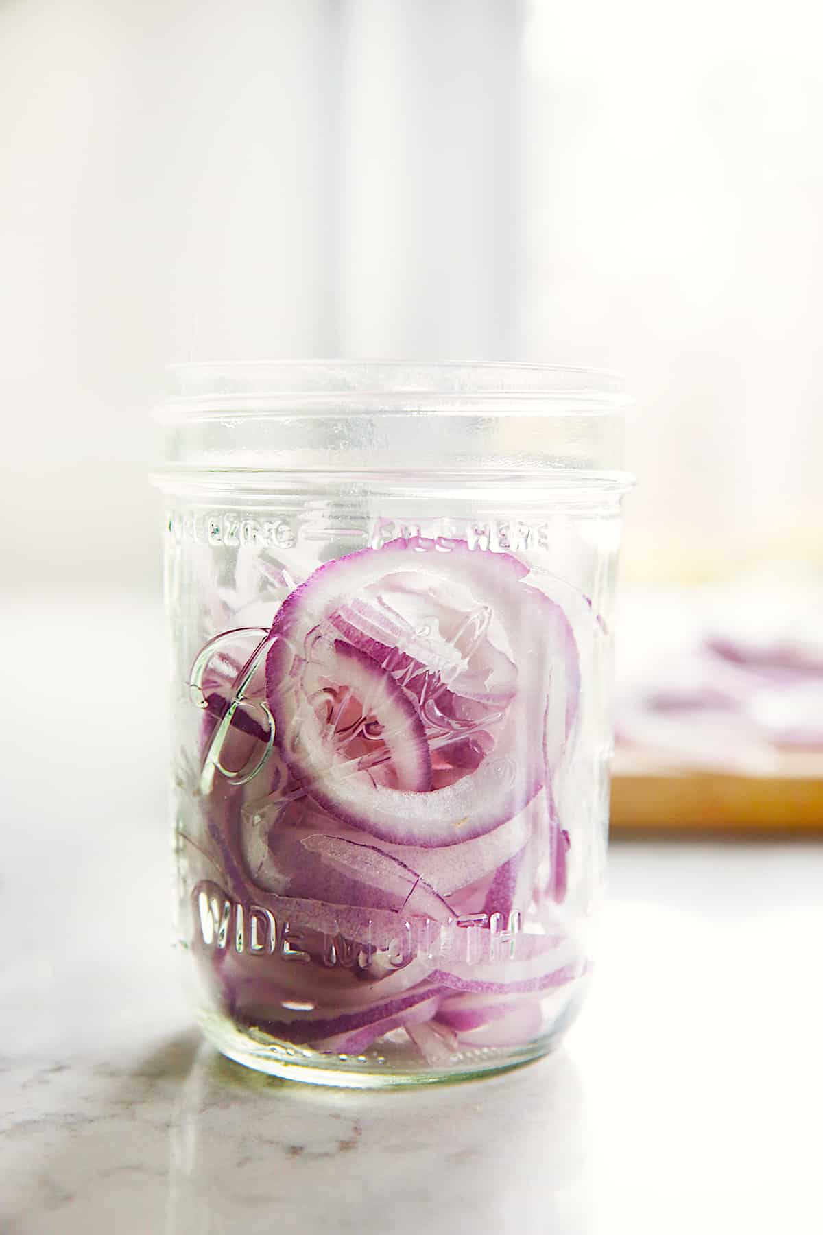 red onions in a mason jar.