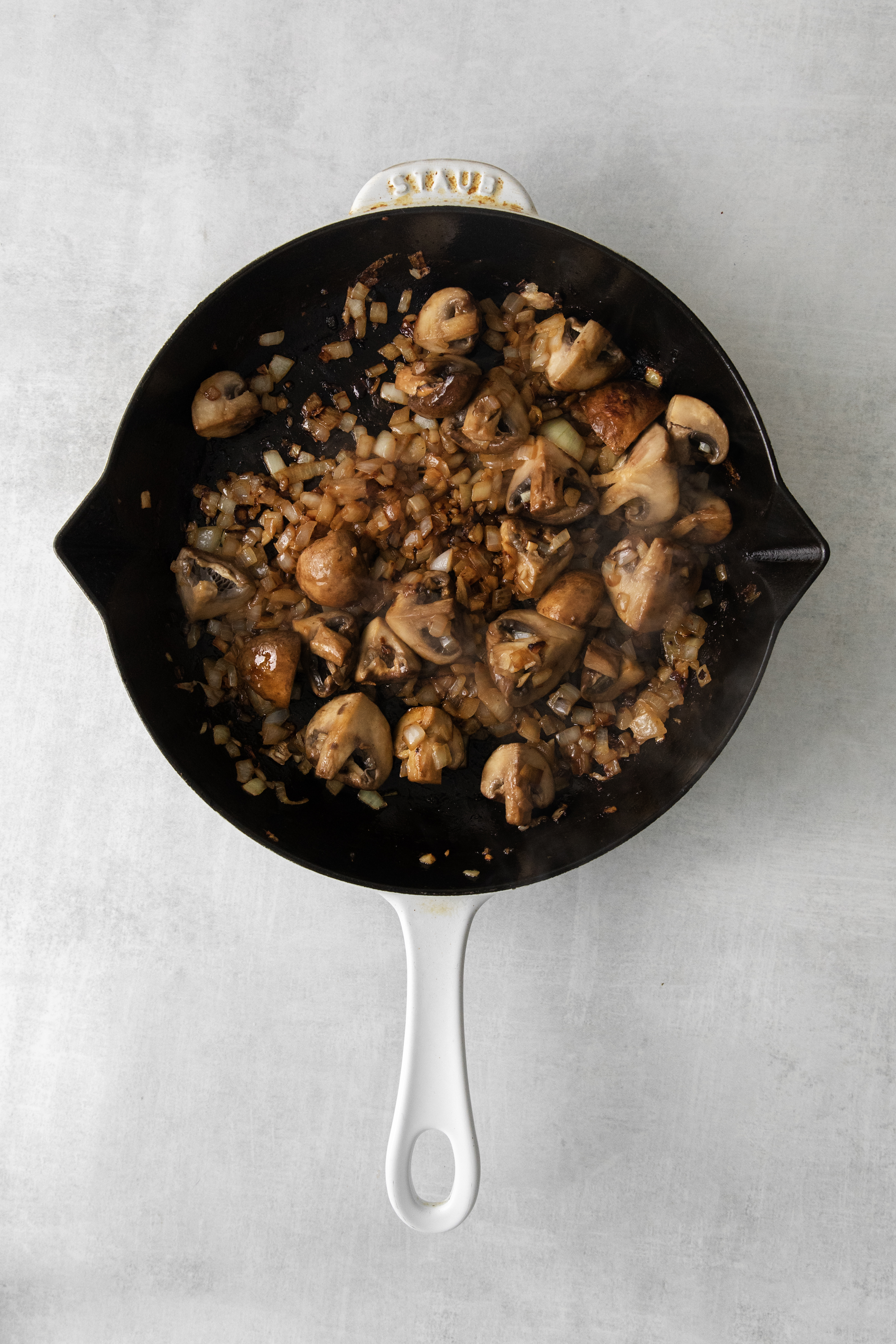 a skillet pan with mushrooms.