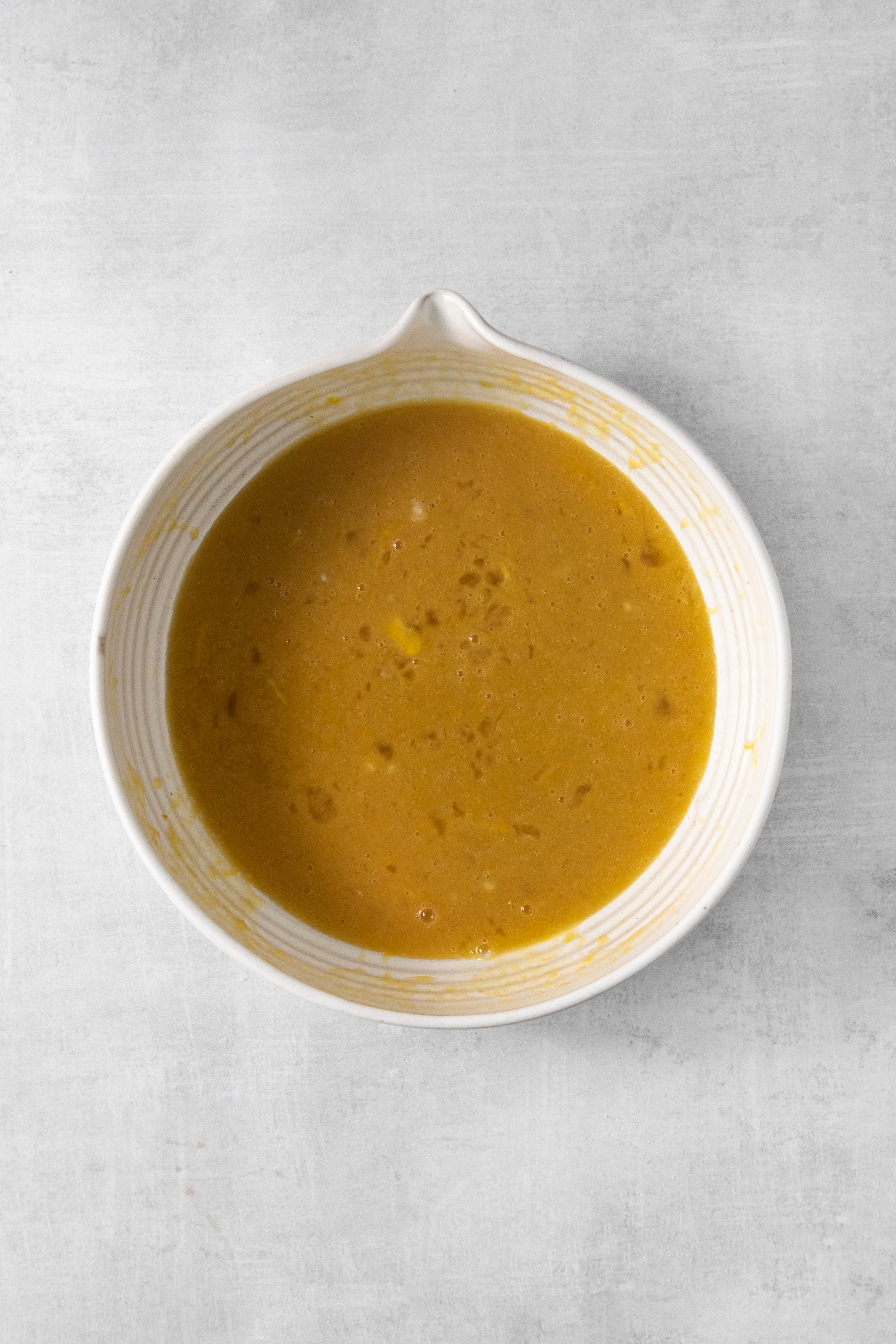 wet ingredients for carrot cake in a bowl.