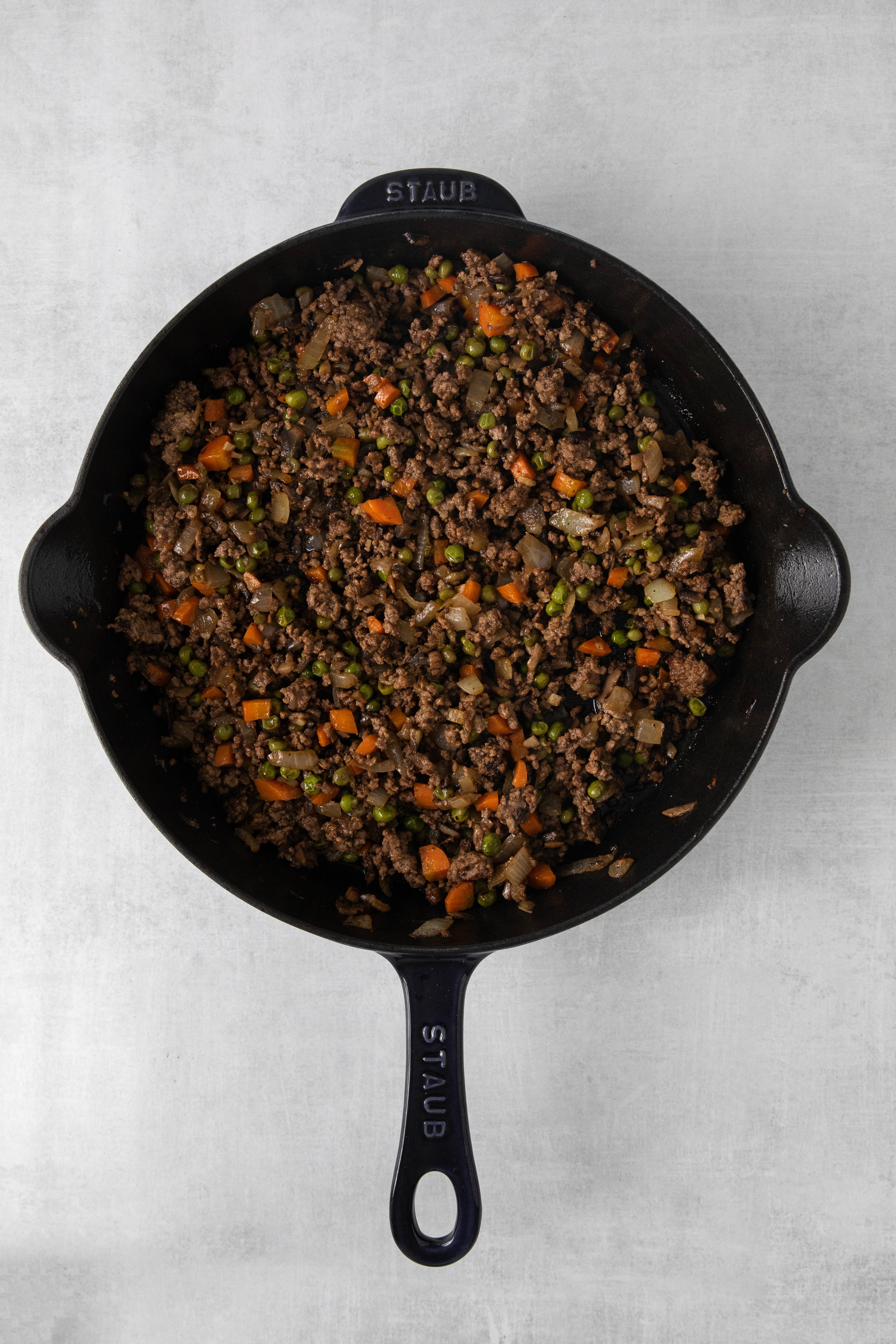 cooked minced meat and vegetables in a pan.