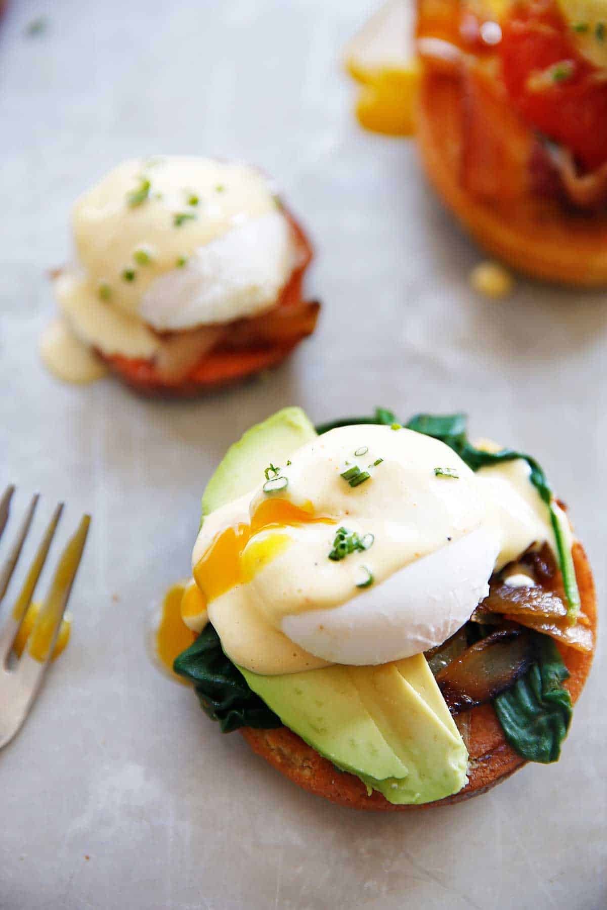 Overhead of an open egg benedict sandwich close-up.