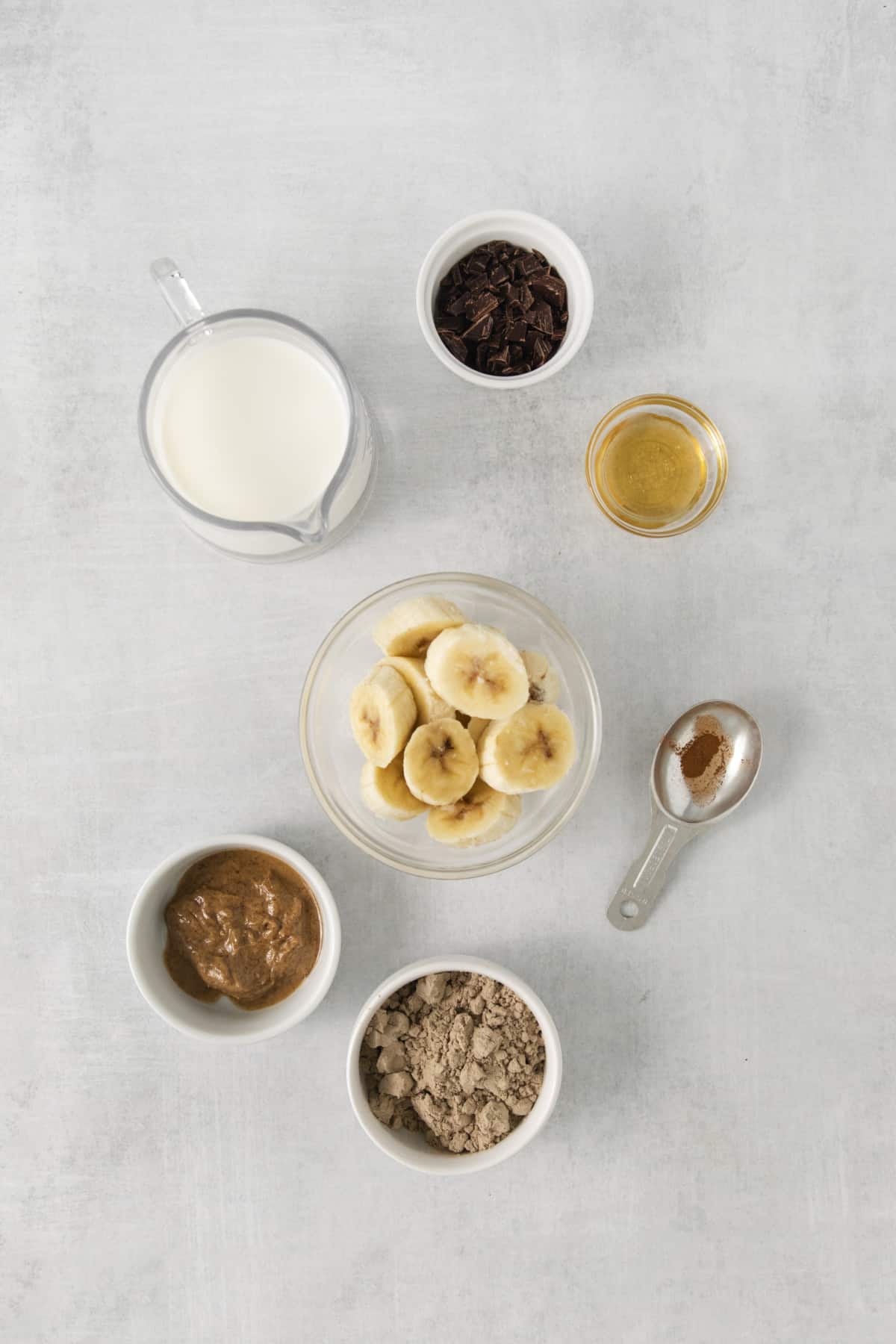 overhead of smoothie ingredients in different bowls.