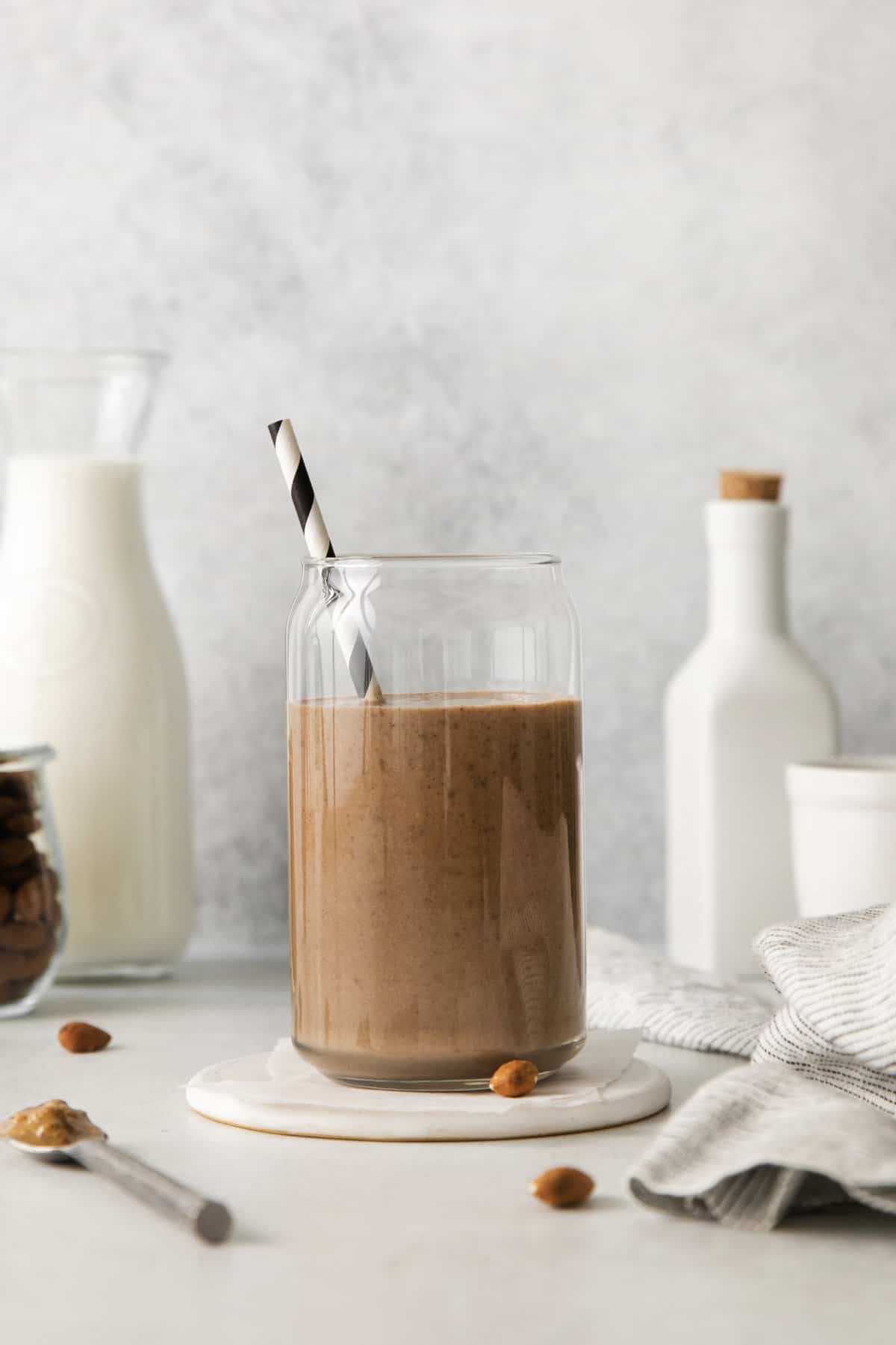 Chocolate milk shake milkshake in a bottle cup straw isolated on a