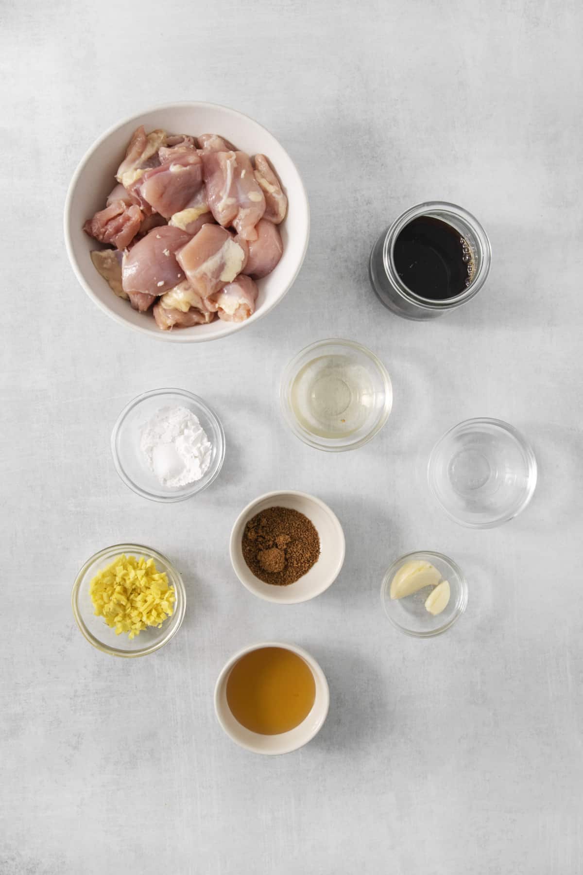 overhead of ingredients for teriyaki chicken in a bowl.