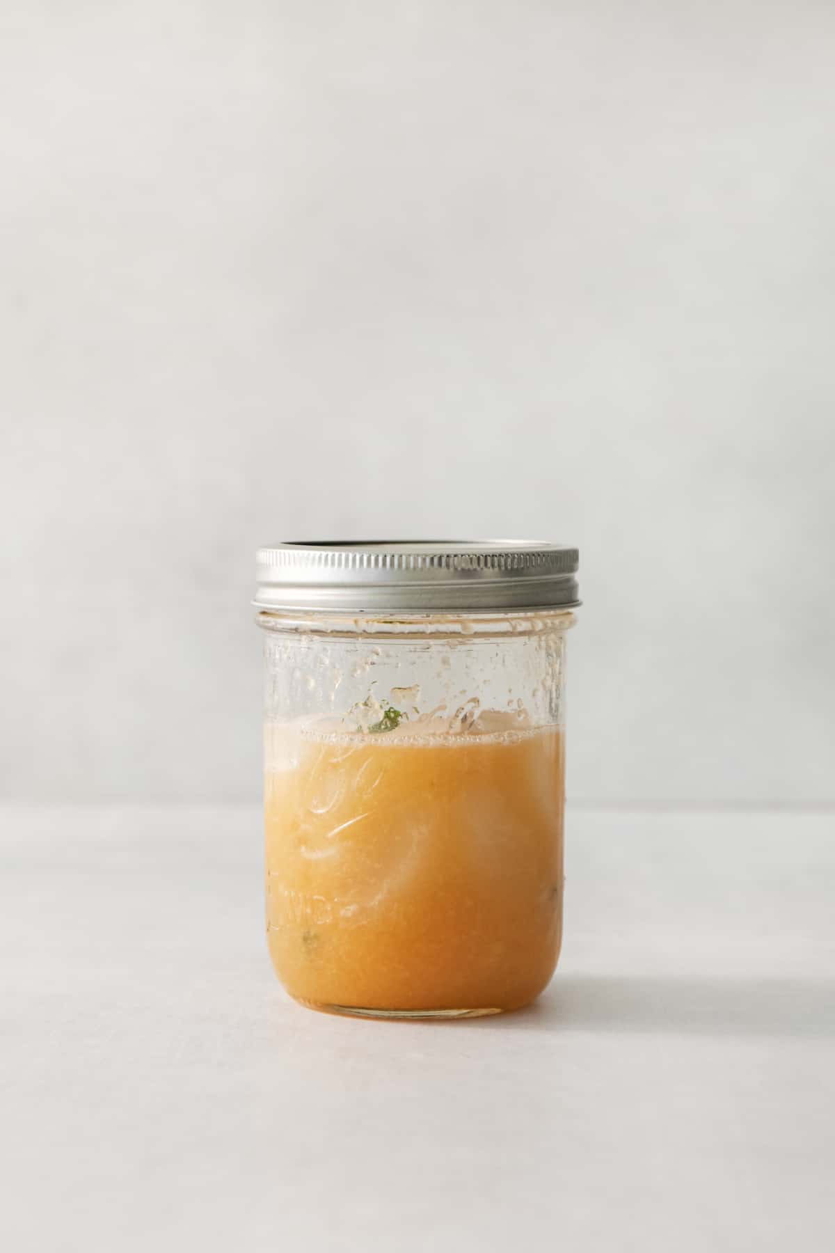 a cantaloupe cocktail in a mason jar.