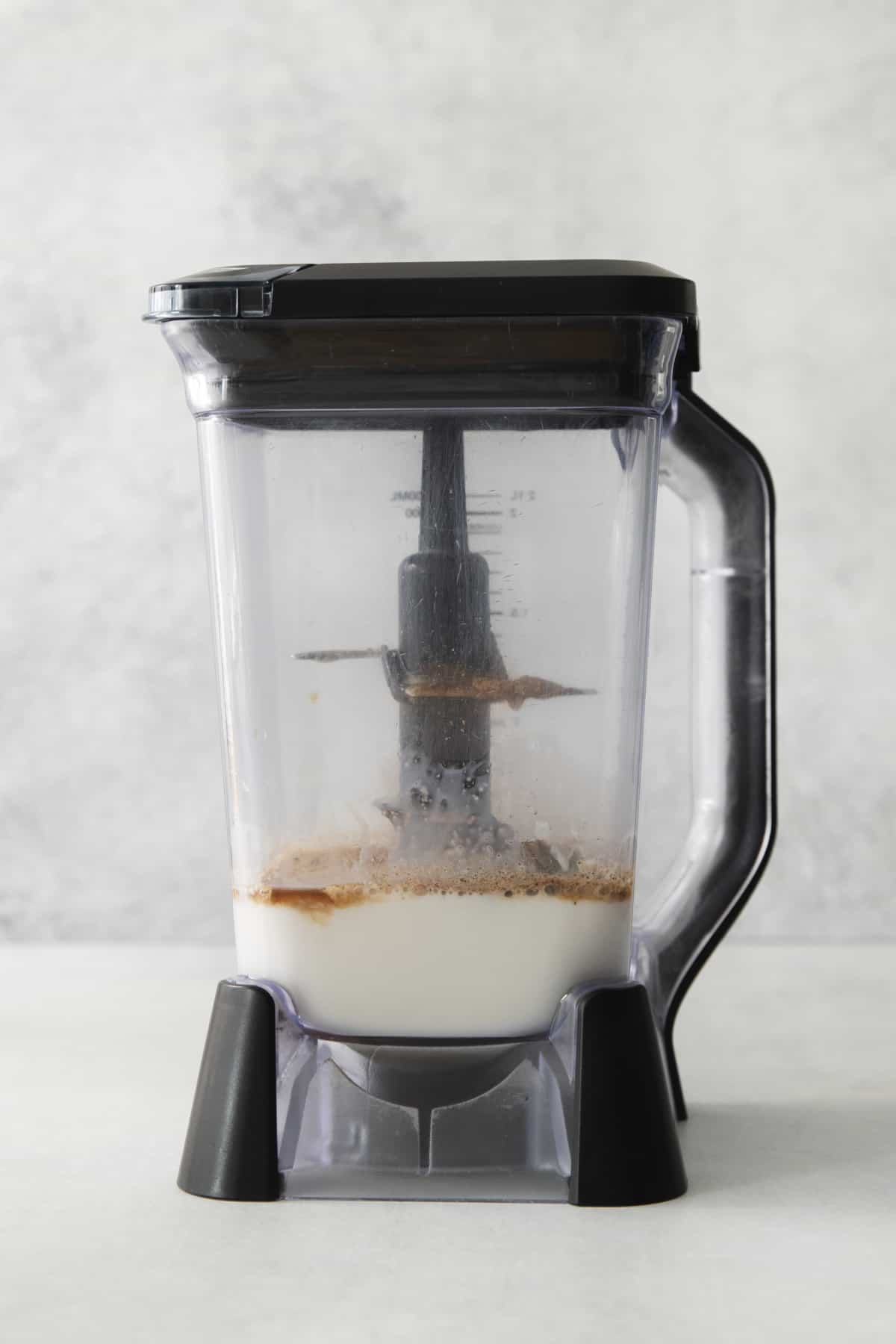 chai spices and almond milk in a blender.